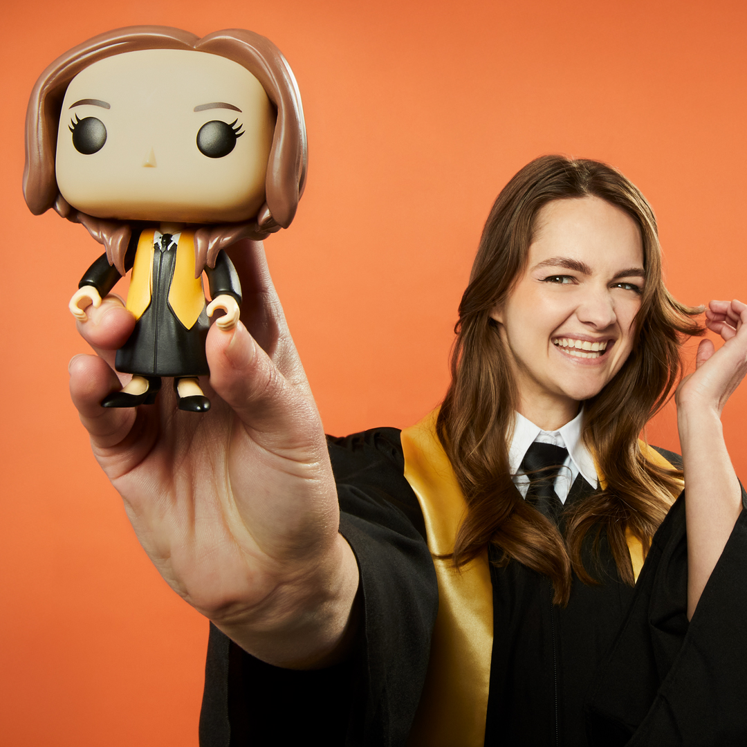 Female graduate holding custom POP! Yourself collectible
